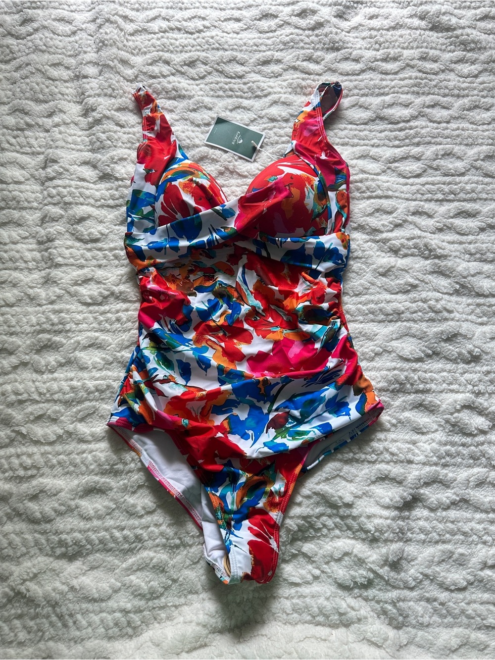 Multi-colored floral one piece tummy control swimsuit in size M.